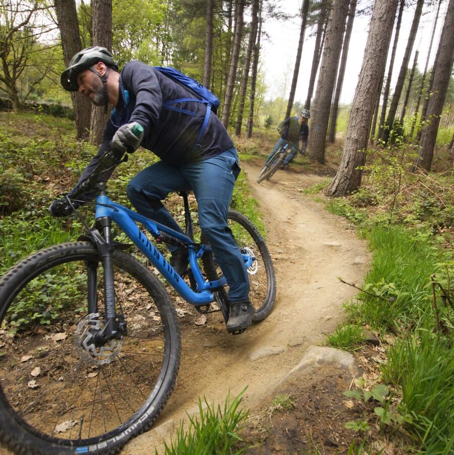 Mountain bike rider participating in beginner's coaching course, Grenoside Woods, Sheffield, Yorkshire